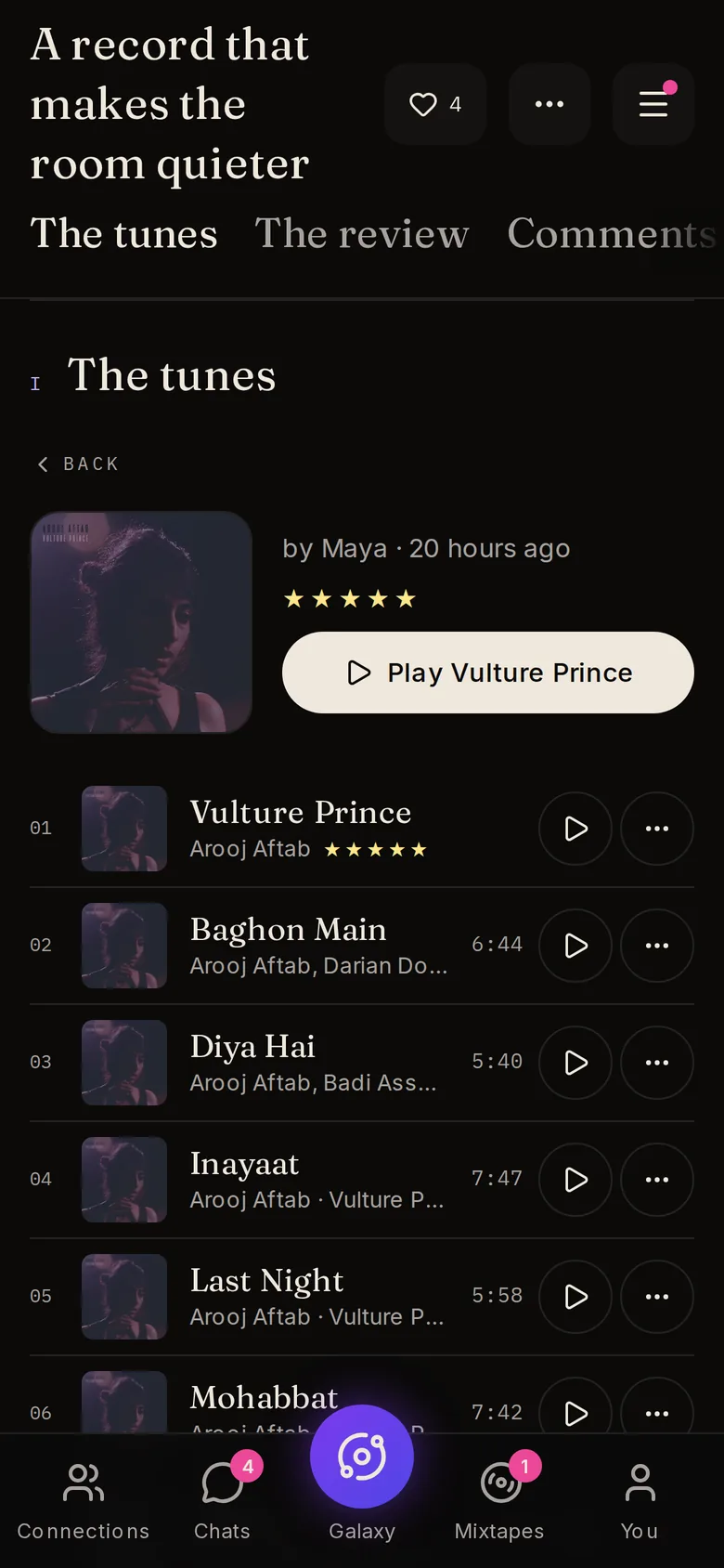 A five-star album review on a phone, with the reviewed record and its Tunes ready to play.